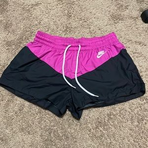 Nike black and pink shorts. 100 % polyester. Size large